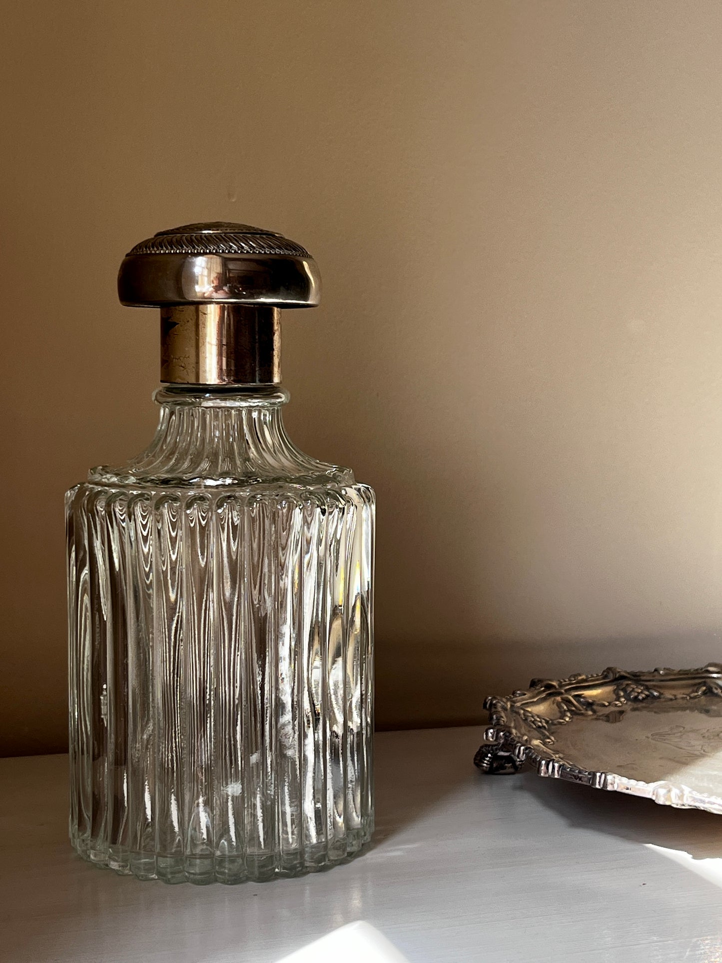 A stunning vintage cut glass decanter with ornate silver plated stopper RESERVED