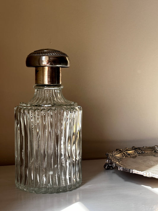 A stunning vintage cut glass decanter with ornate silver plated stopper RESERVED