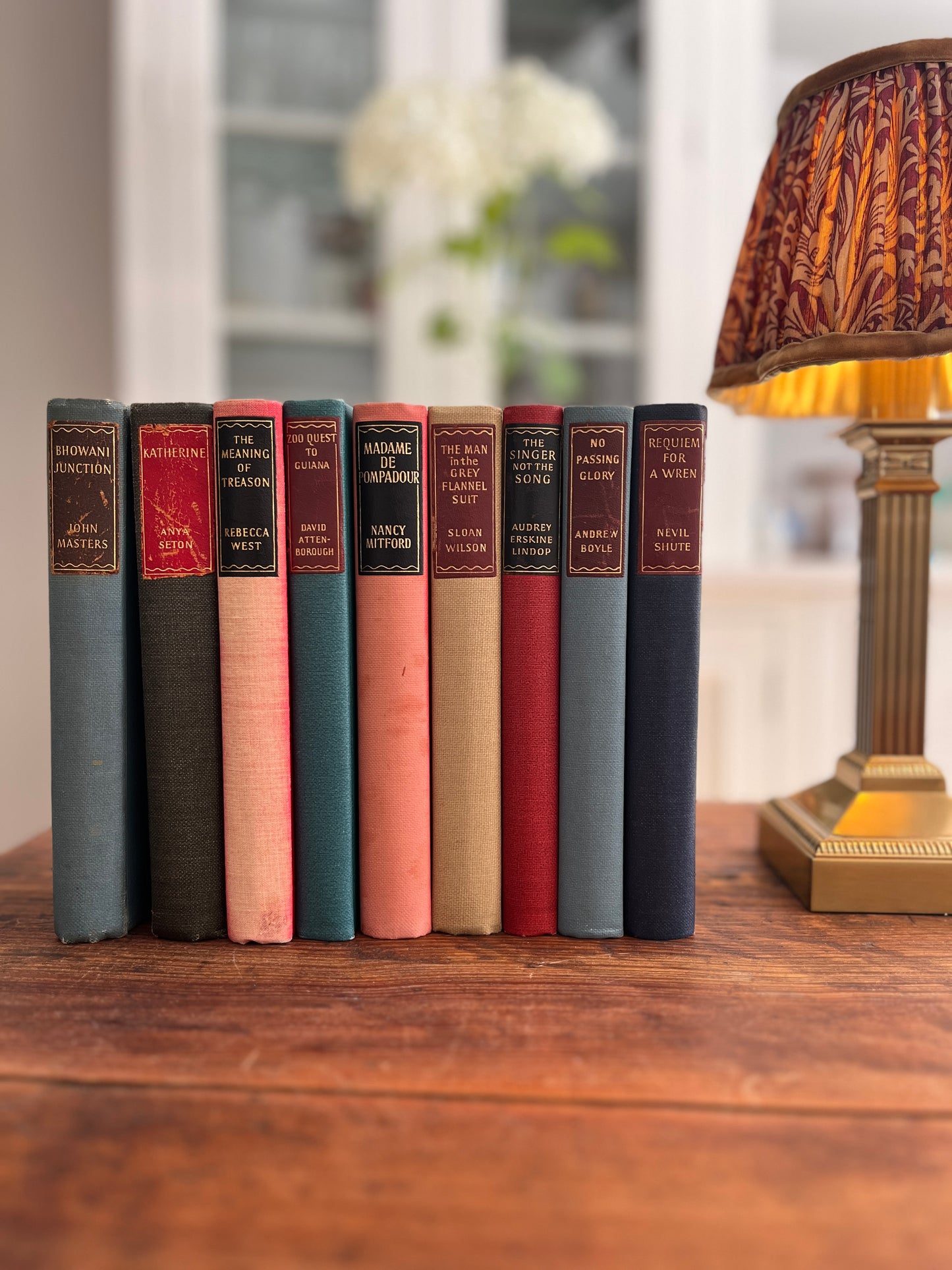 Collection of 9 Hardback books with Coloured backs. Various Titles