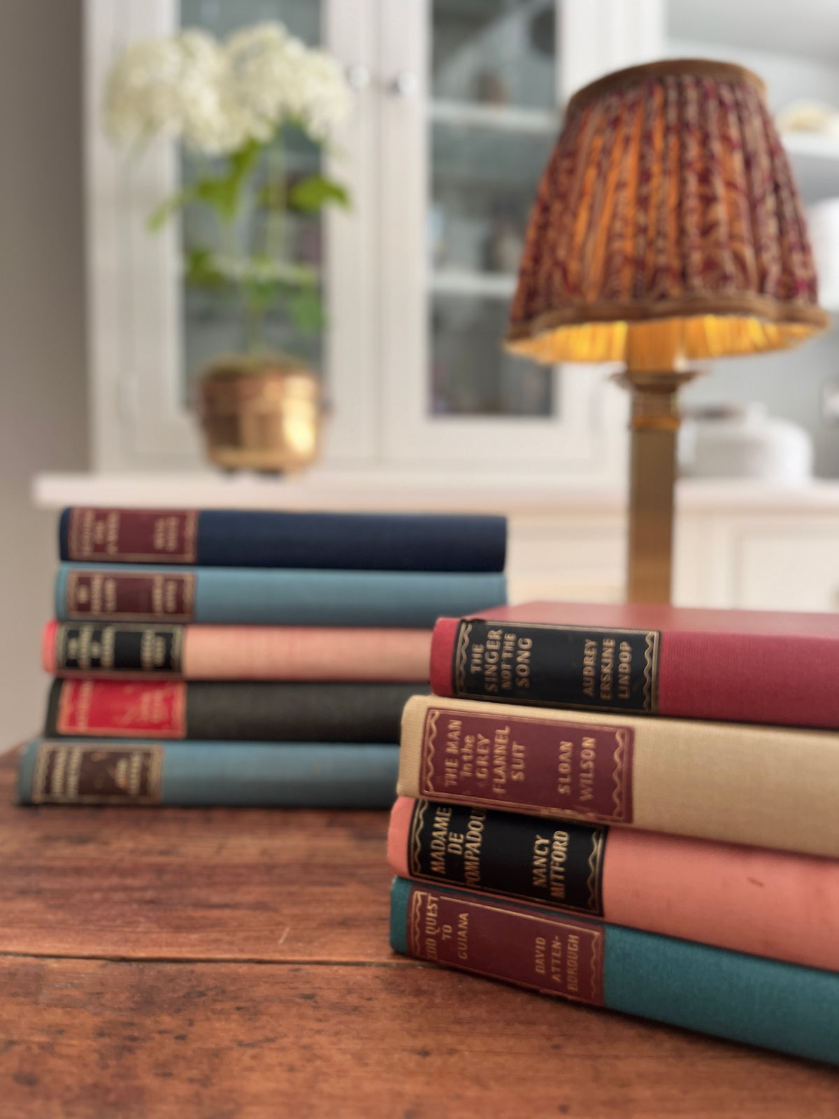 Collection of 9 Hardback books with Coloured backs. Various Titles