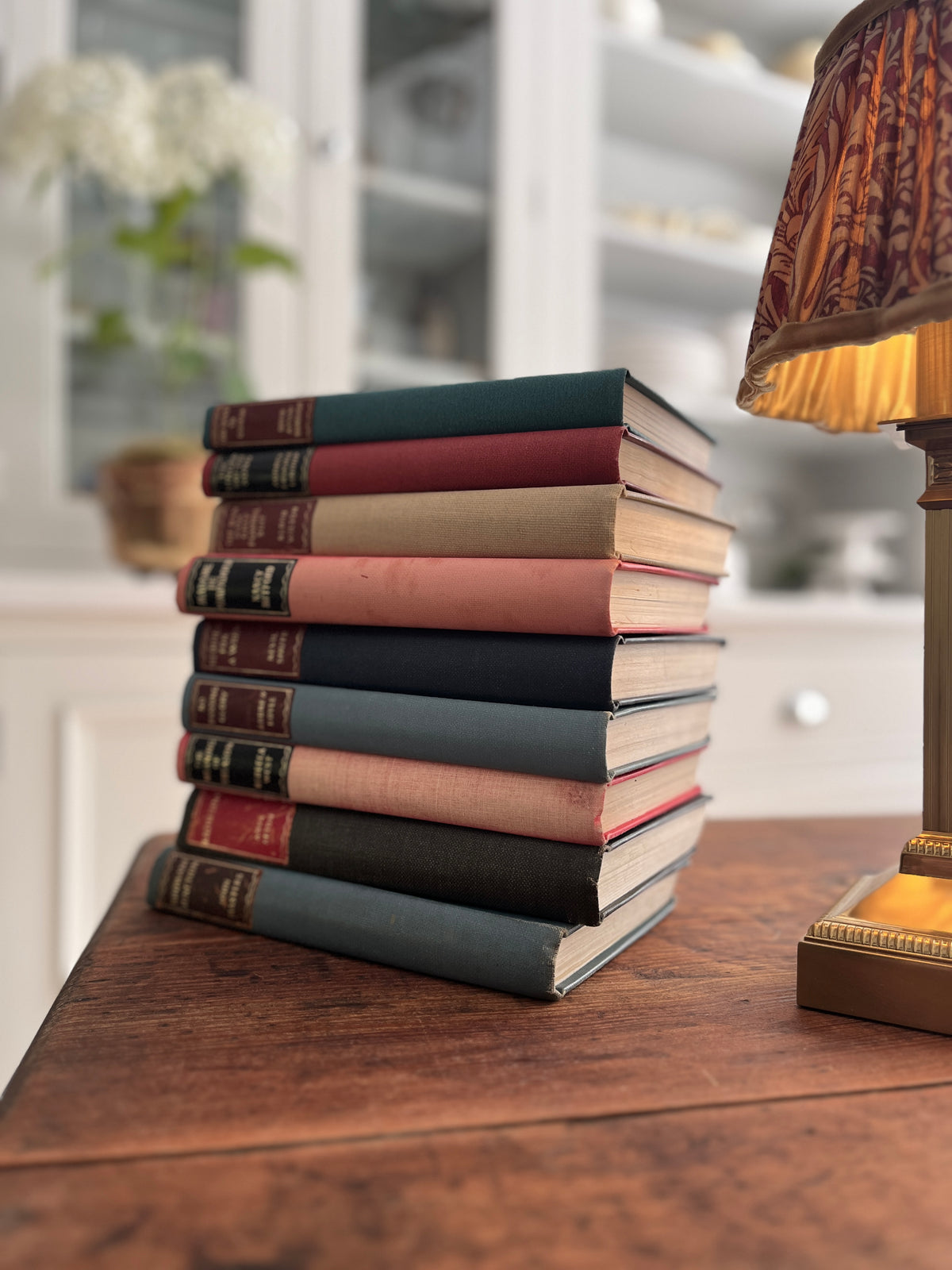 Collection of 9 Hardback books with Coloured backs. Various Titles